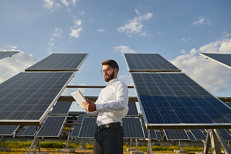 consultant in front of solar panels