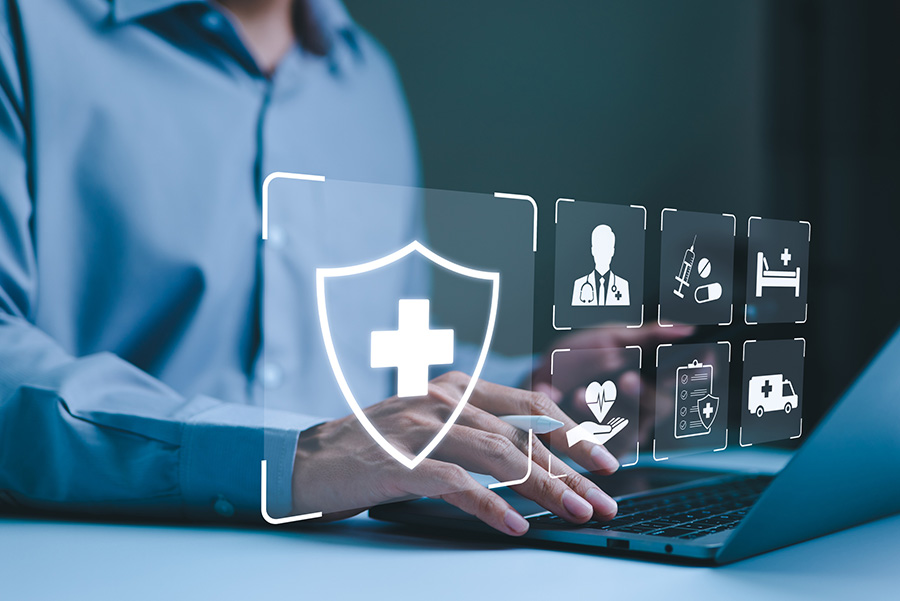 healthcare professional on laptop