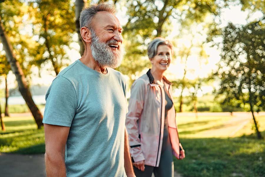 Happy seniors walking outside
