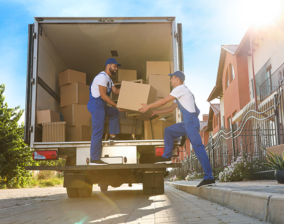 Movers loading boxes into a moving truck.jpg