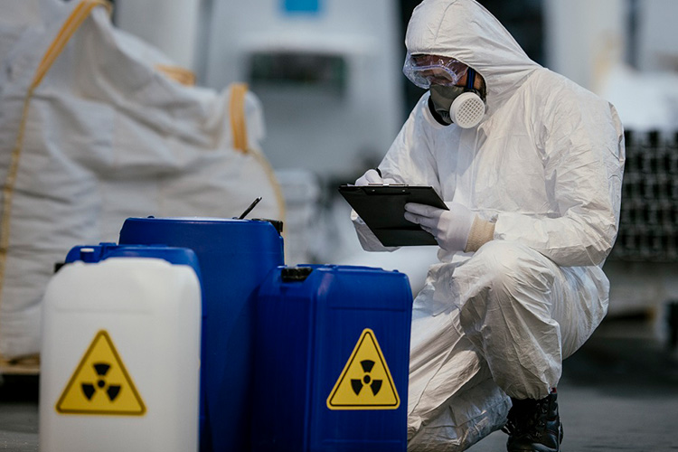 Workers in radiation protection gear