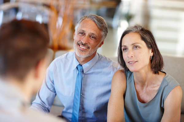 adult couple meeting advisor