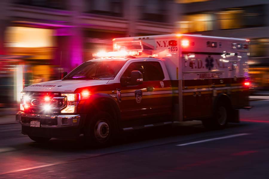 An ambulance driving at night