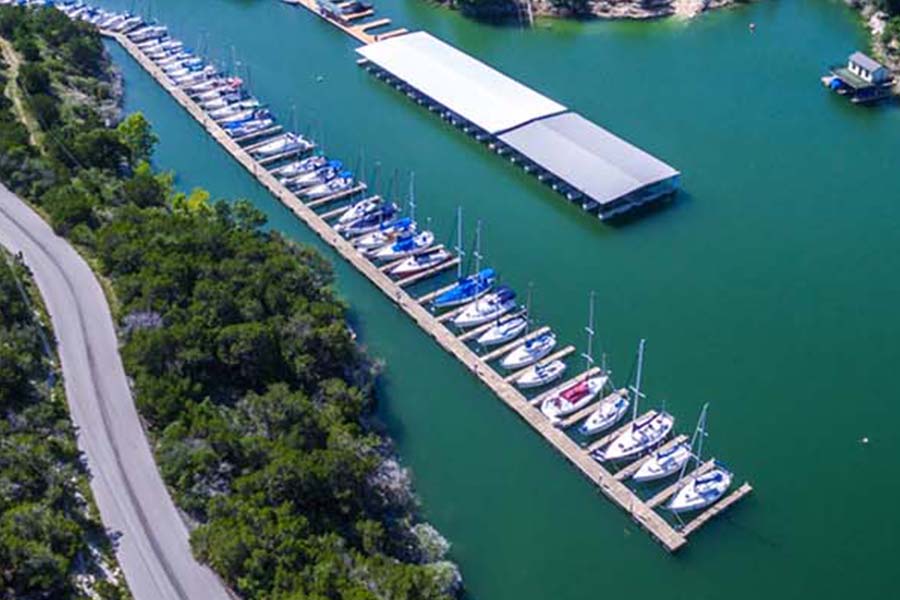 boats on a long lake dock