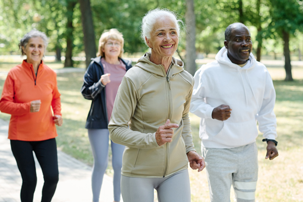 elderly people running in the park