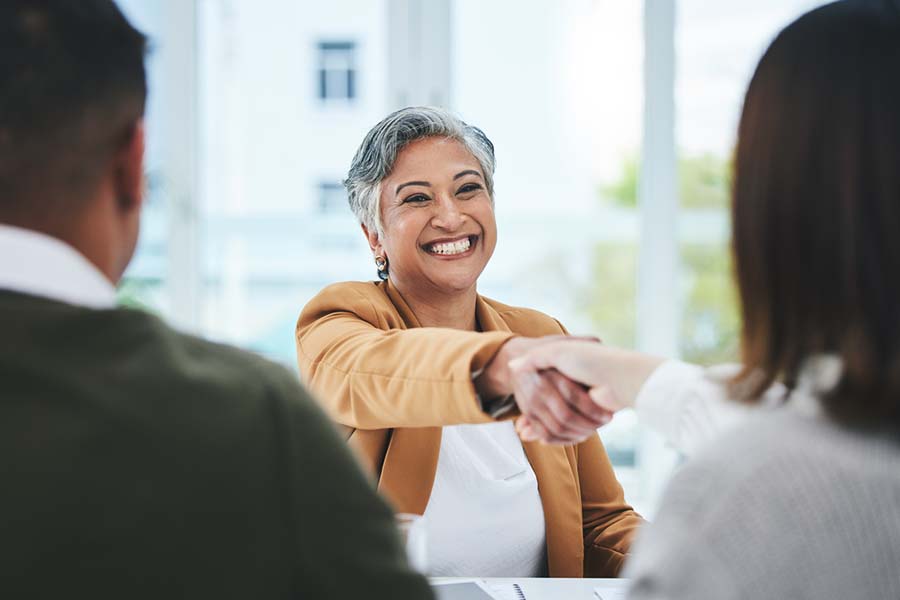 employee shaking hands at hiring