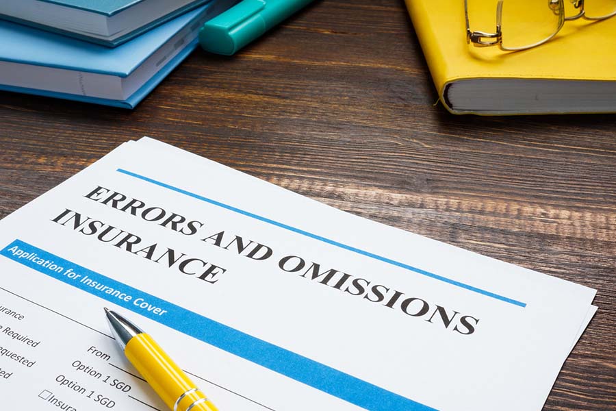 errors and ommissions insurance paperwork on a desk