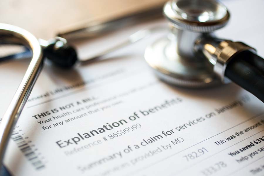 explanation of benefits paperwork on a desk