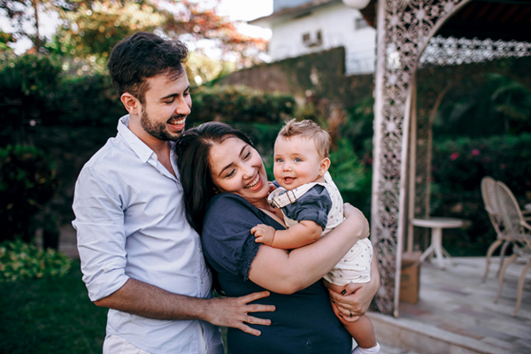 family holding baby outside