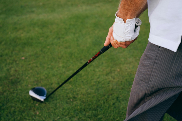 man holding golf club