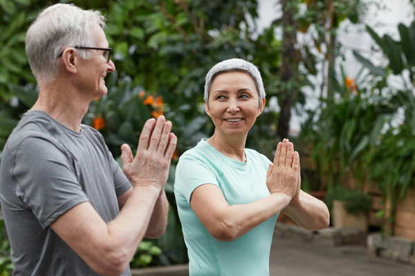 older couple doing yoga