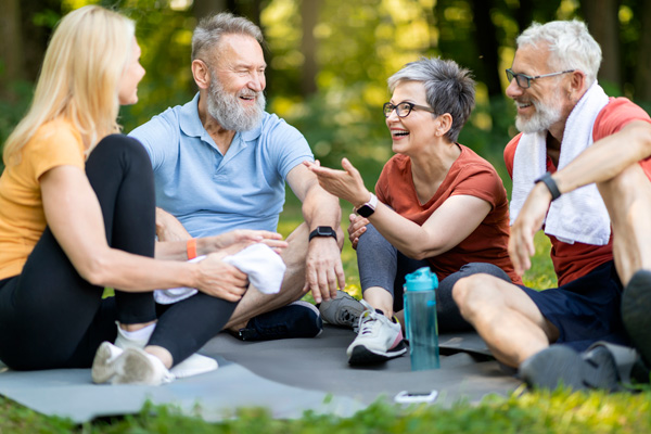 older leisure group of happy older adults relaxing