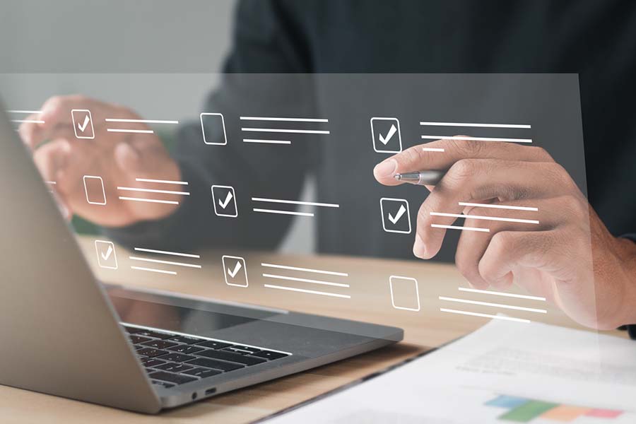 person on laptop viewing checkboxes