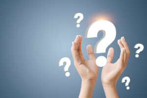 question marks floating over hands