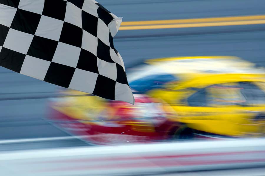 race car on track and checkered flag