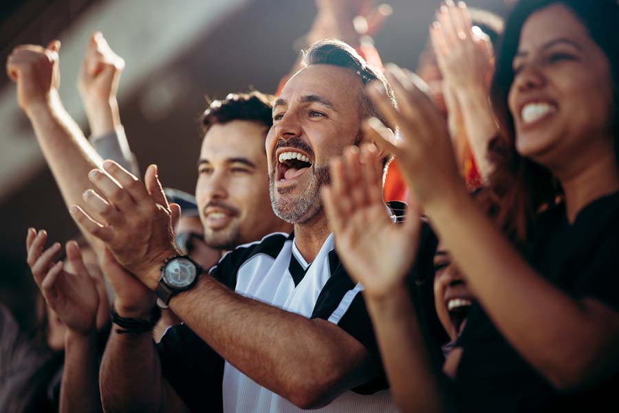 sports fans cheering at an event